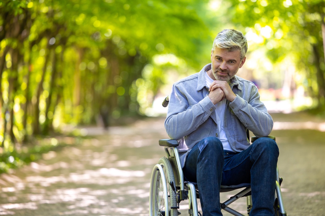 Man with Multiple sclerosis sits in a wheel chair